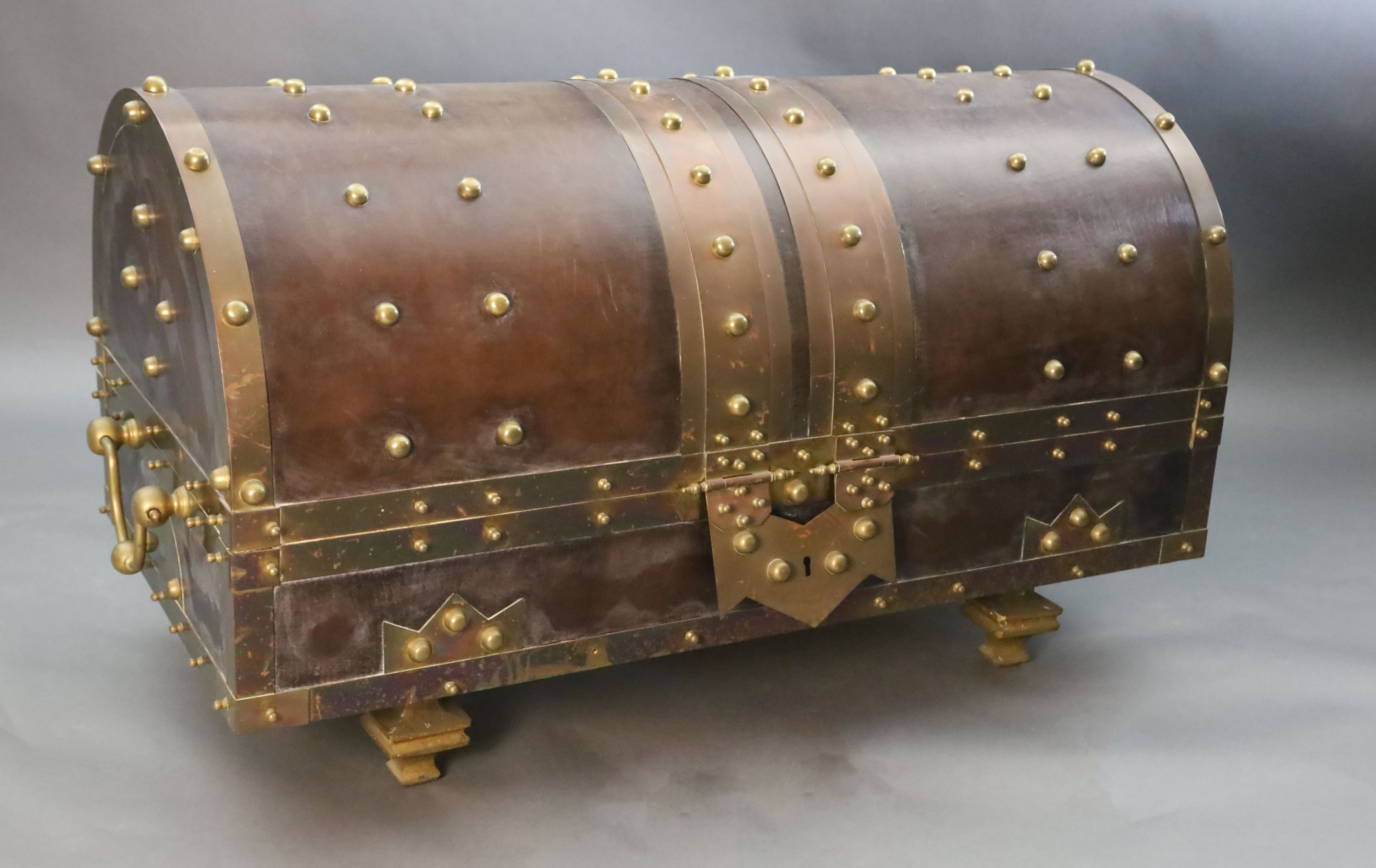 An ormolu and brass mounted leather dome top coffer,